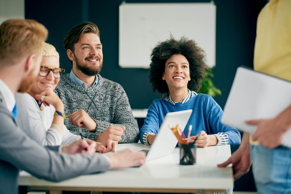 Team of people around a desk